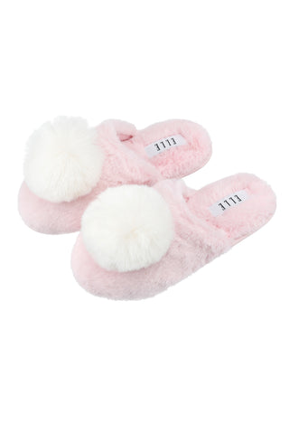Cosy pink faux fur slippers, perfect for keeping your feet warm and stylish at home.