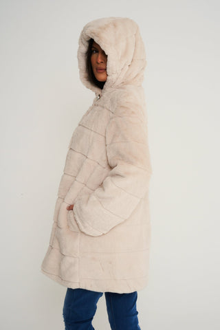 Elegant cream faux fur coat with a hood, ideal for adding a touch of luxury to your winter wardrobe.