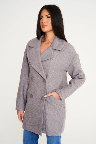 Cosy grey wool coat for women, combining fashion and comfort, perfect for chilly days out.