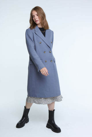 Stylish blue double-breasted long coat, perfect for layering and adding a chic touch to any outfit. 