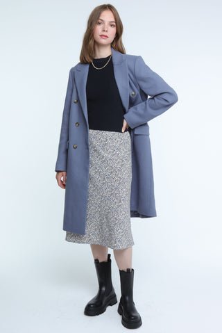 Elegant blue long coat with double-breasted design, ideal for staying warm and fashionable this season.